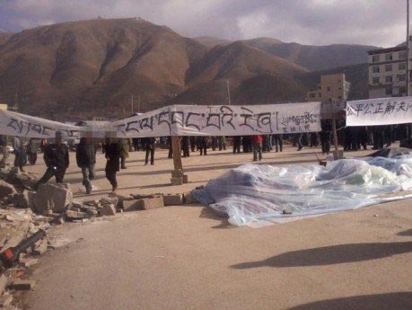 banners hung by protesters in Kyegu