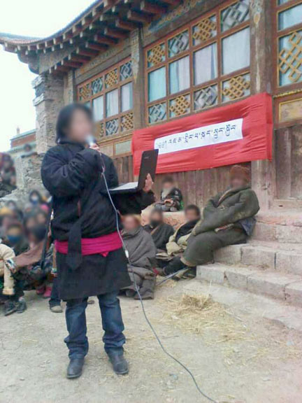 young students and writers wearing traditional Tibetan clothing recite poems and sing