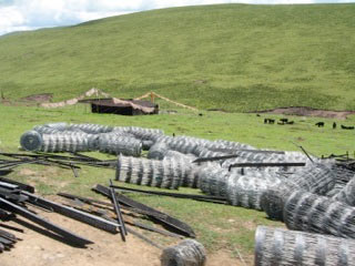 Bales of fencing in Kham, Tibet, in preparation for enclosing an area of grassland under nomad settlement policies.