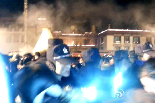 Paramilitary police in black uniforms