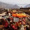 A photo of the Dalai Lama placed on top of ruins in Yushu.